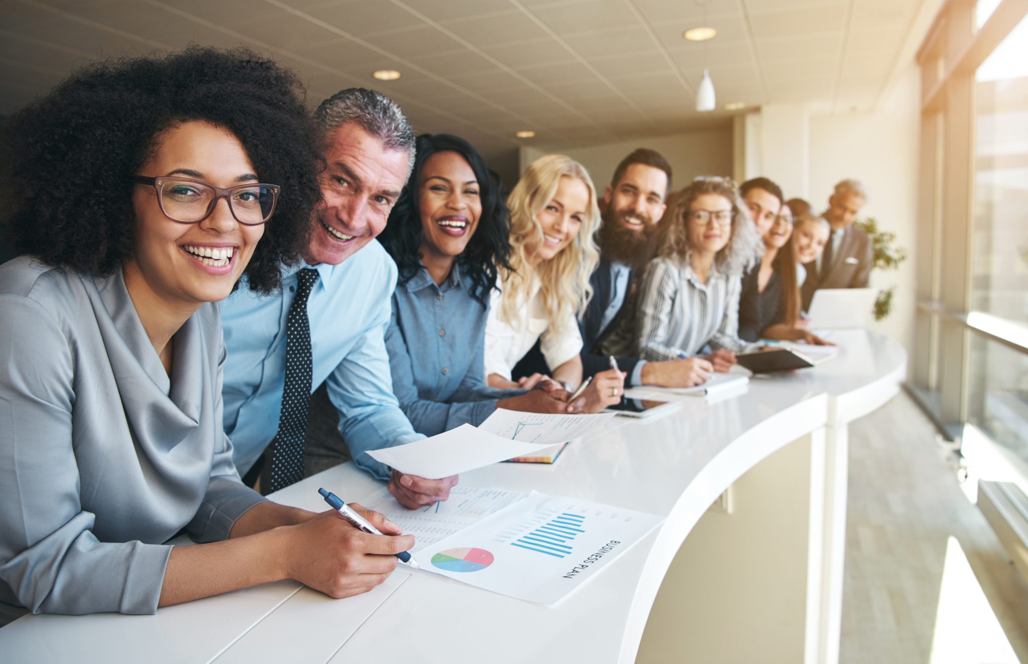 A diverse cohort of professionals at a G&M training session